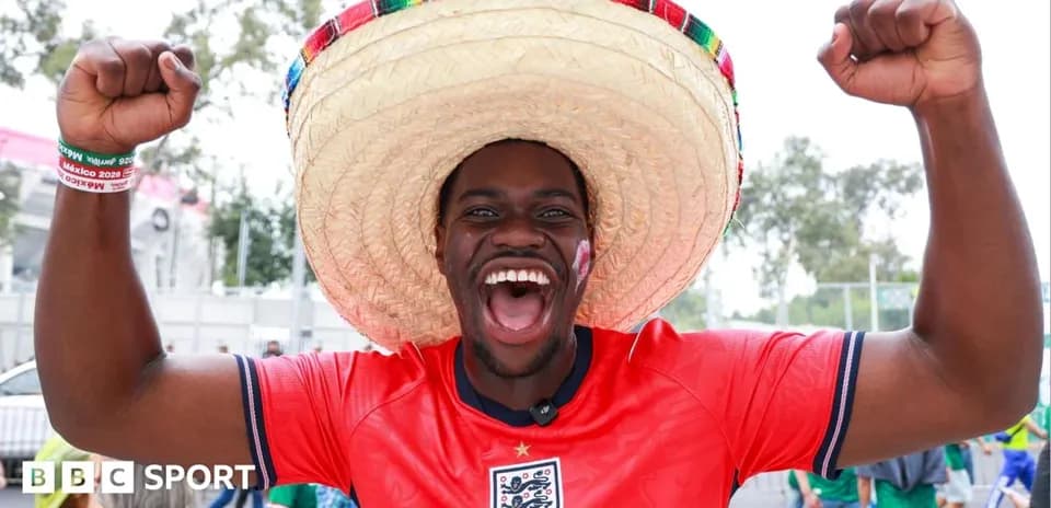 Fan in sombrero celebrating at football event