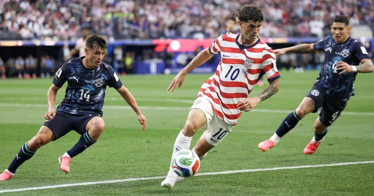 Cristian Pulisic dribbling past defenders in match Cristian Pulisic dribbling past defenders in match